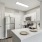 Newly renovated apartment home with white countertops, cabinets, and stainless steel appliances